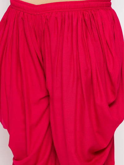 Magenta solid rayon dhoti salwar with elasticated waistband and drawstring.