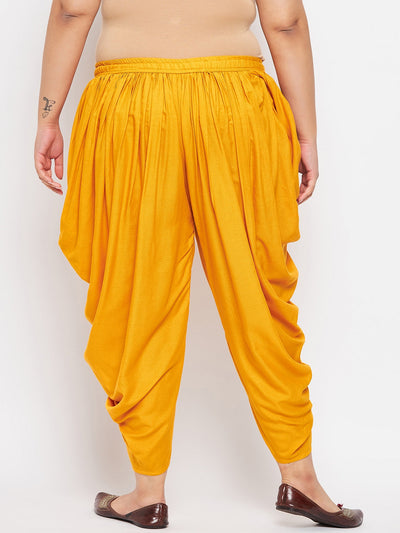 Mustard solid rayon dhoti salwar with elasticated waistband and ankle-length drape.