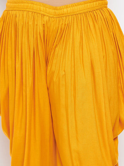 Mustard solid rayon dhoti salwar with elasticated waistband and drawstring.
