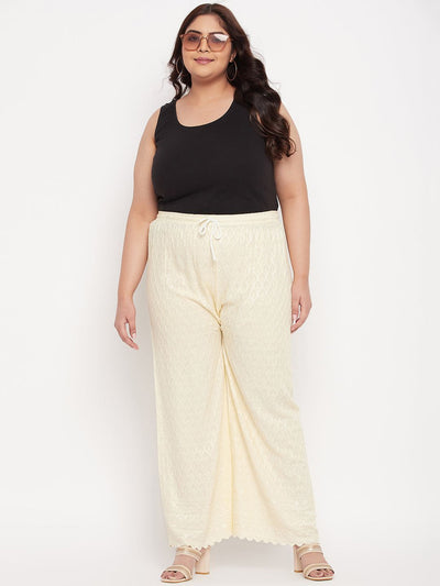 Cream embroidered chikankari rayon palazzo with elastic waistband and drawstring.