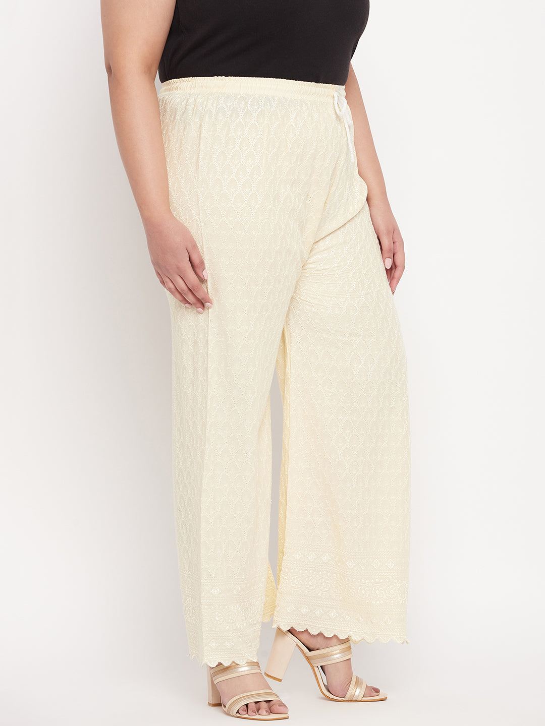 Cream embroidered Chikankari rayon palazzo with elastic waistband and drawstring.
