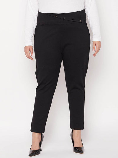 Black solid regular fit jegging in NR Roma fabric for women.