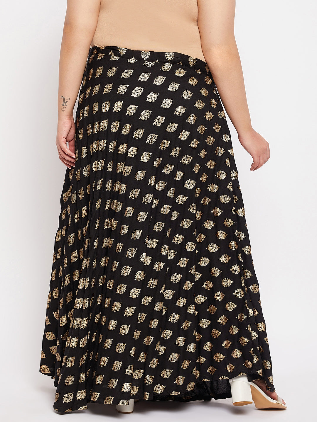 Black printed flared rayon skirt with drawstring waistband.