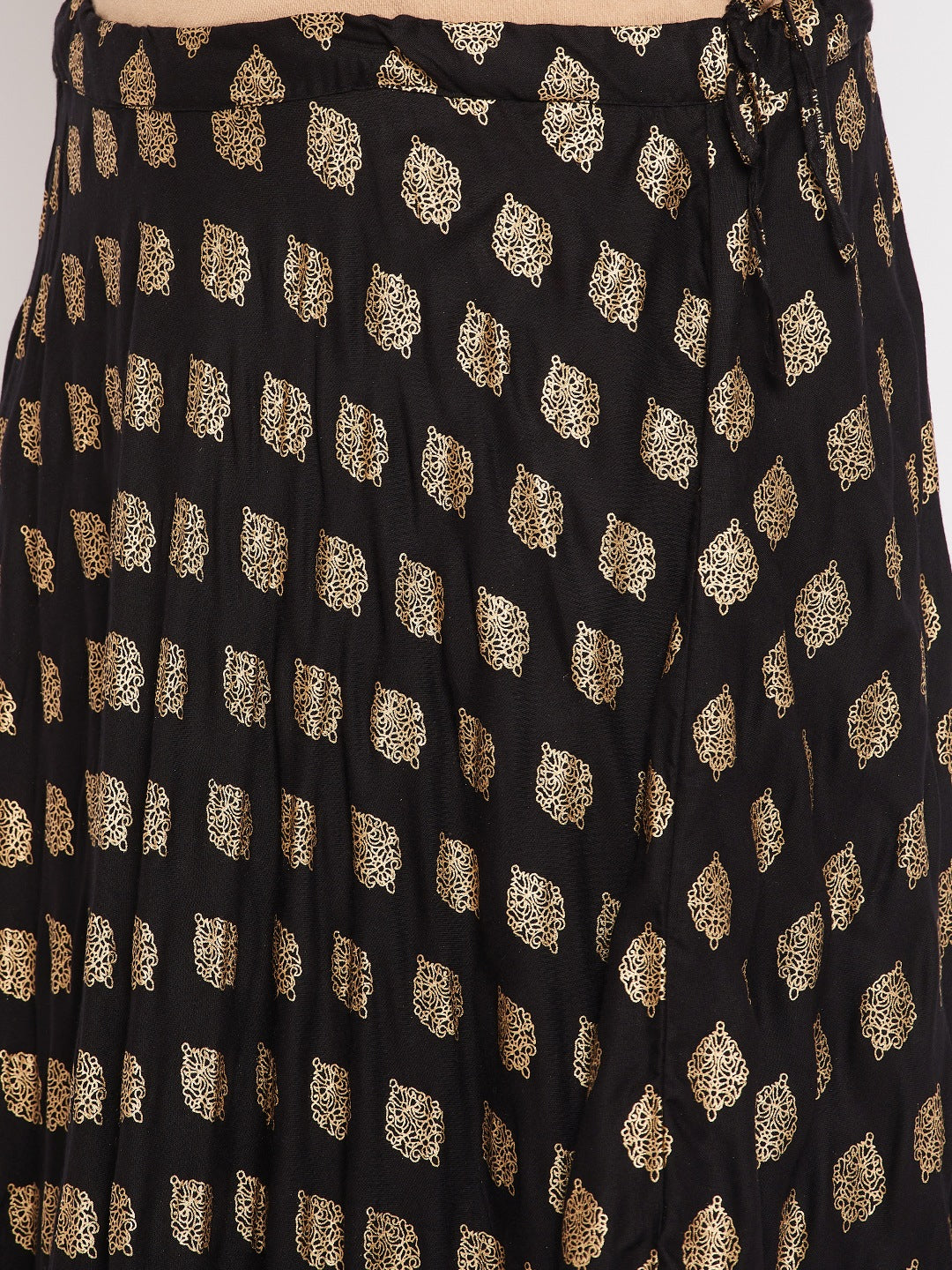 Black printed flared rayon skirt with drawstring waistband.