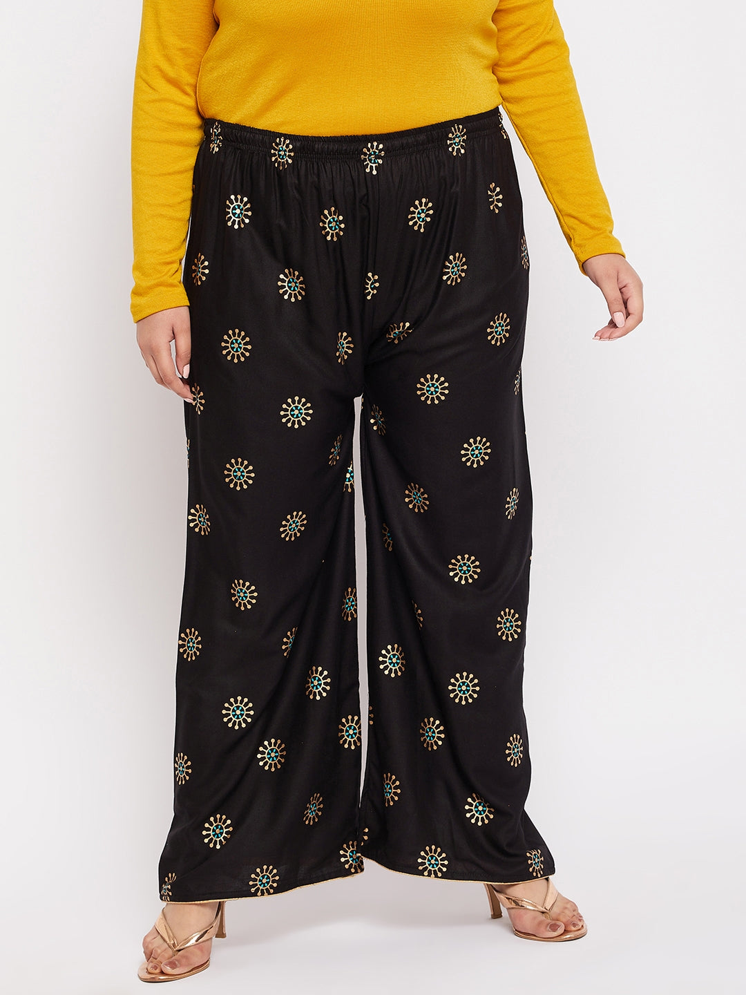 Black printed rayon palazzo with elasticated waistband and drawstring.