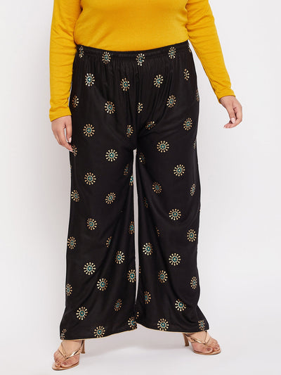 Black printed rayon palazzo with elasticated waistband and drawstring.