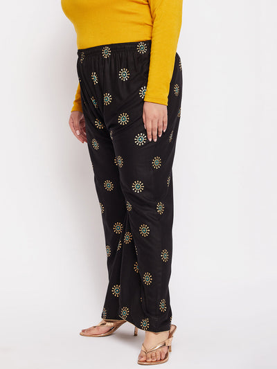 Black printed rayon palazzo with elasticated waistband and drawstring.