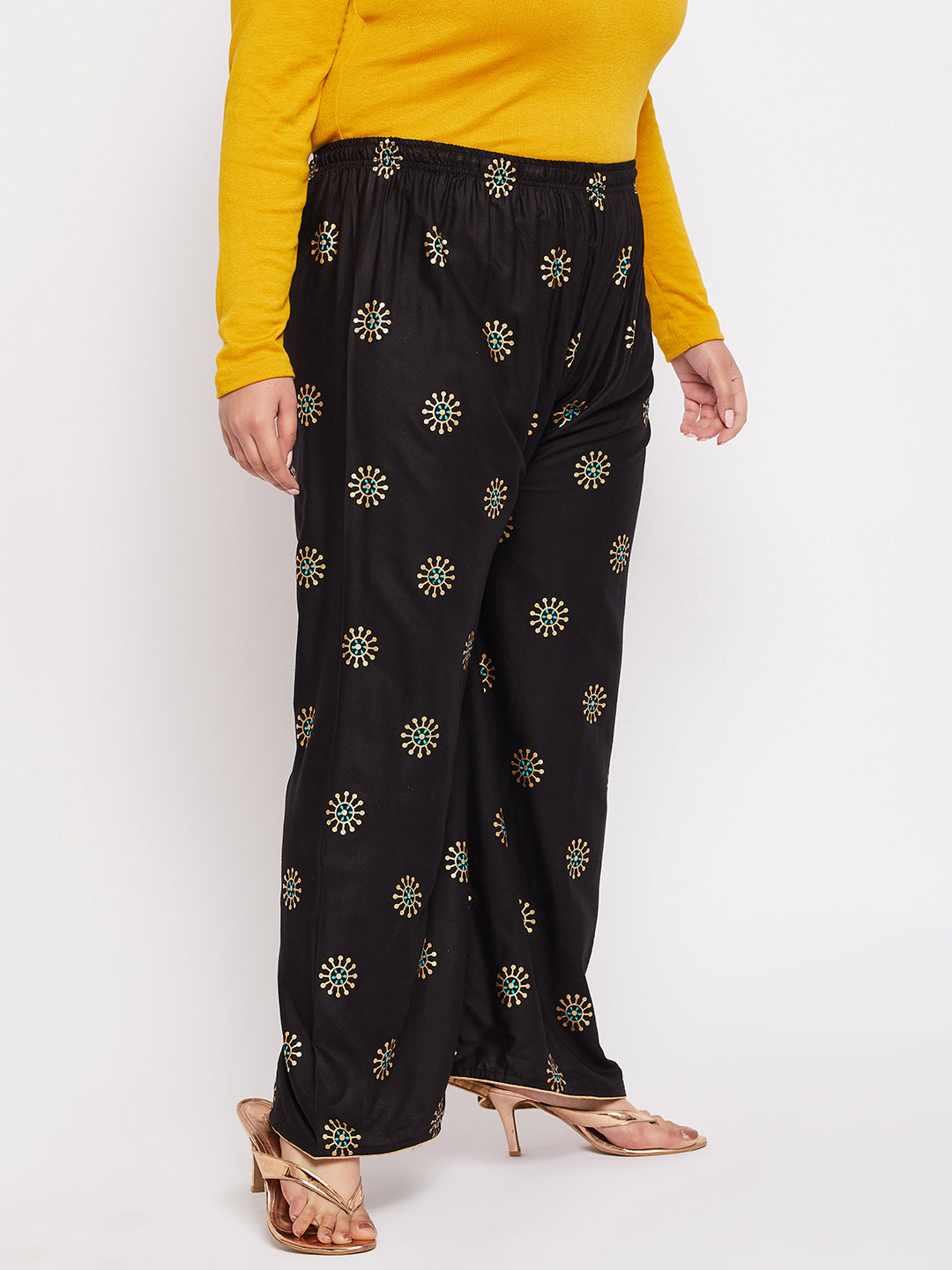 Black printed rayon palazzo with elasticated waistband and drawstring.