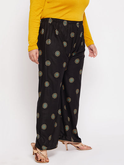 Black printed rayon palazzo with elasticated waistband and drawstring.