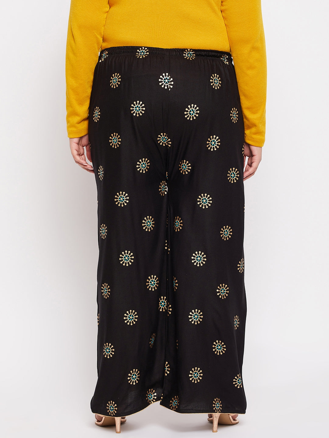 Black printed rayon palazzo with elasticated waistband and drawstring.