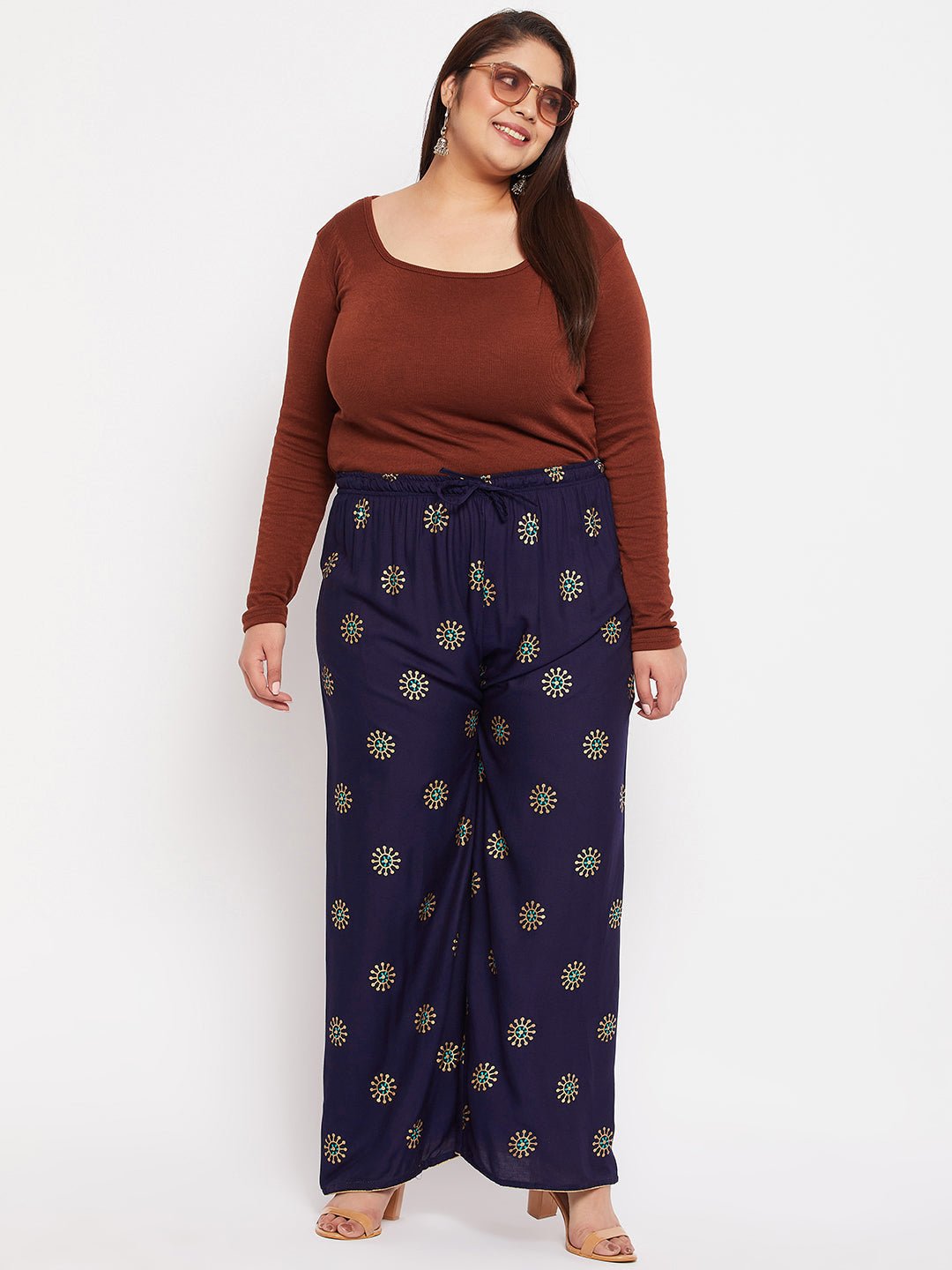 Navy blue printed rayon palazzo with elasticated waistband and drawstring.