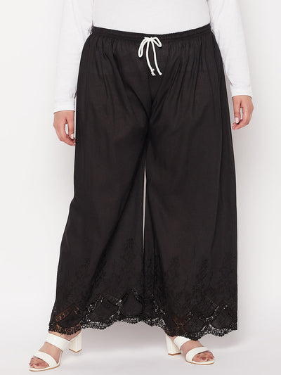 Black embroidered cotton straight palazzo with solid hem design and drawstring waistband.