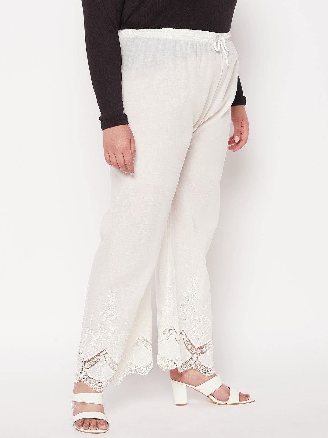 Cream embroidered cotton straight palazzo with lace hem and elastic waistband.