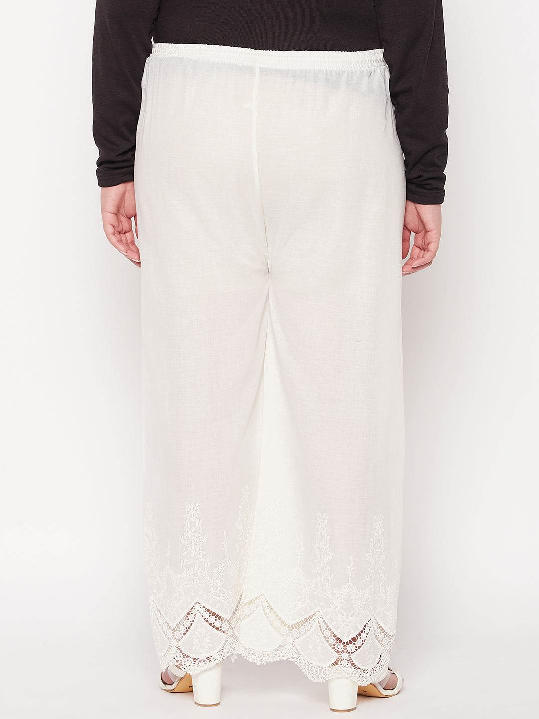 Cream embroidered cotton straight palazzo with solid hem design and elasticated drawstring waistband.