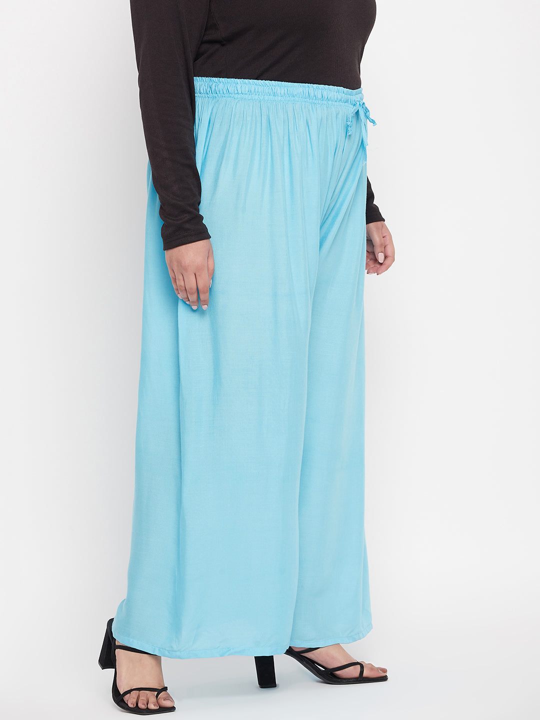Sky blue solid rayon palazzo with elastic waistband and drawstring.