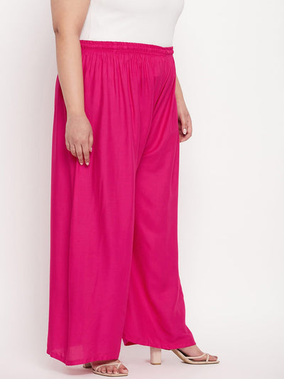 Magenta solid rayon palazzo with elasticated waistband and drawstring.