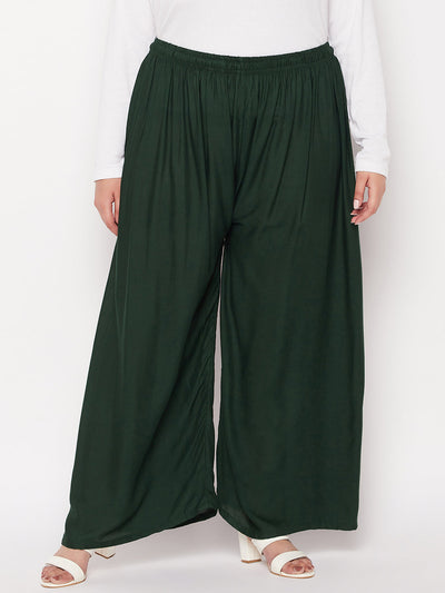 Bottle Green Solid Rayon Palazzo with elasticated waistband and drawstring.
