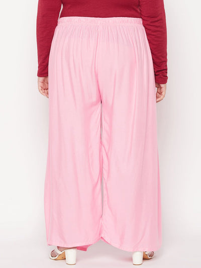 Baby pink solid rayon palazzo with elasticated waistband and drawstring.