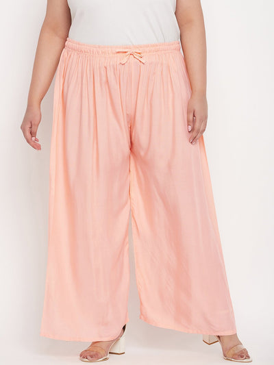 Peach solid rayon palazzo with elasticated waistband and drawstring.