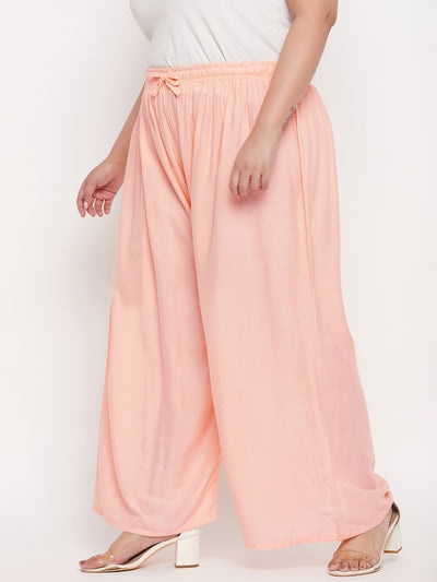 Peach solid rayon palazzo with elasticated waistband and drawstring.