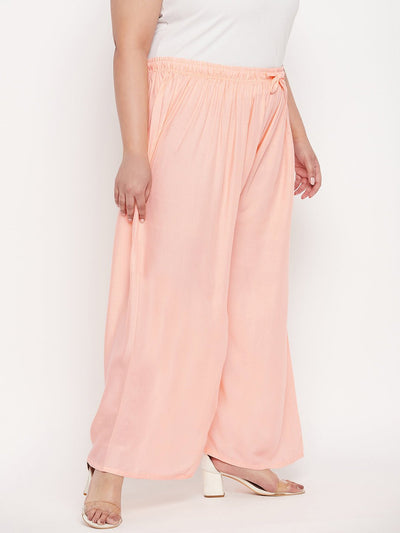 Peach solid rayon palazzo with elasticated waistband and drawstring.