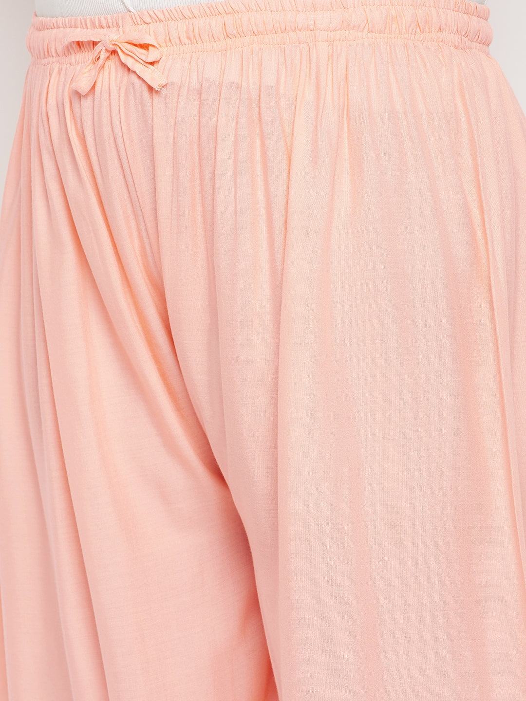 Peach solid rayon palazzo with elasticated waistband and drawstring.