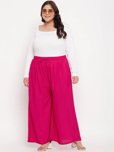 Magenta solid rayon jumbo sharara with elasticated waistband.