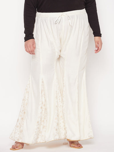 Cream printed rayon flared sharara with elasticated waistband and drawstring.