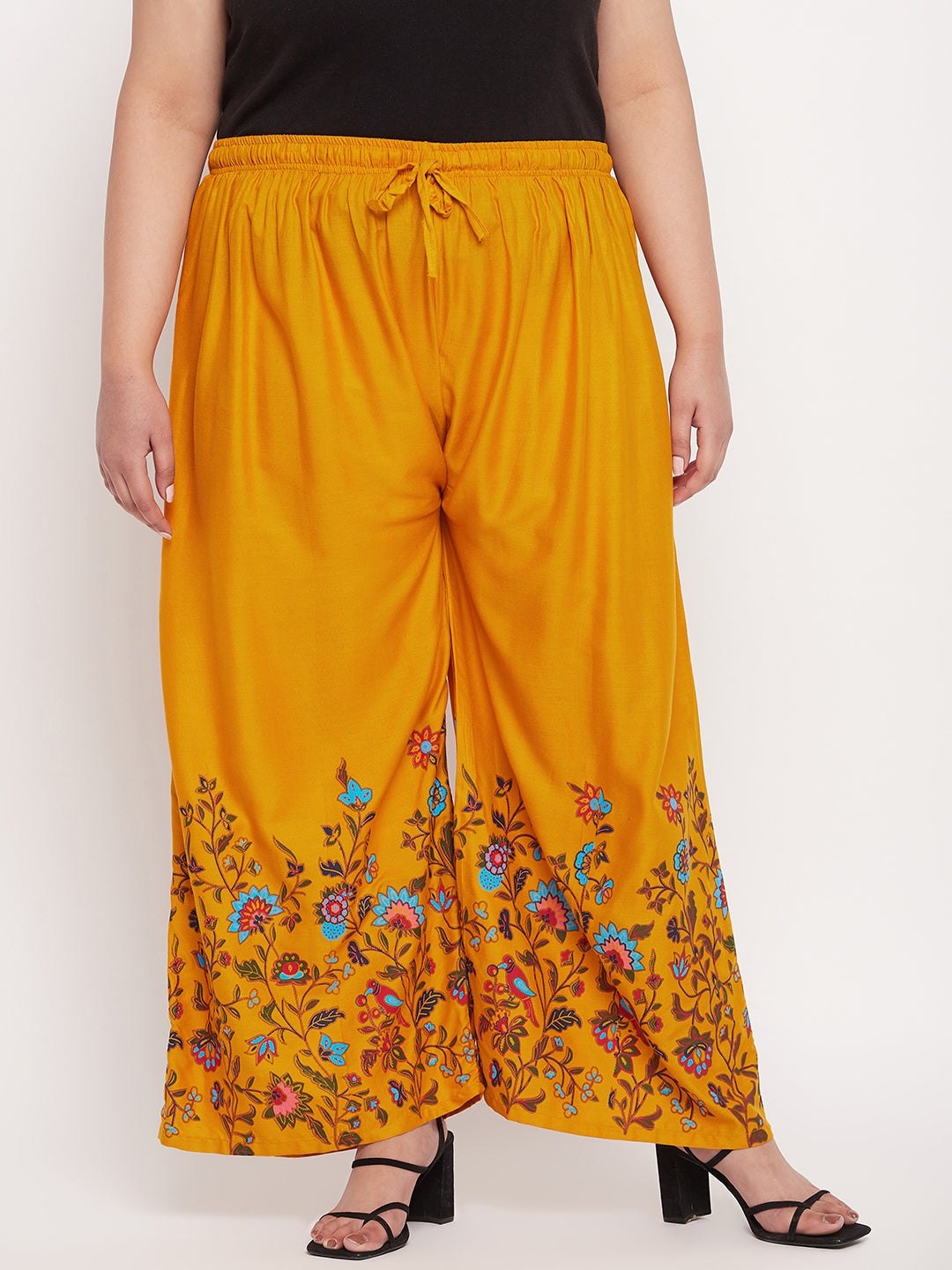 Mustard printed rayon palazzo with floral design and elasticated waistband.