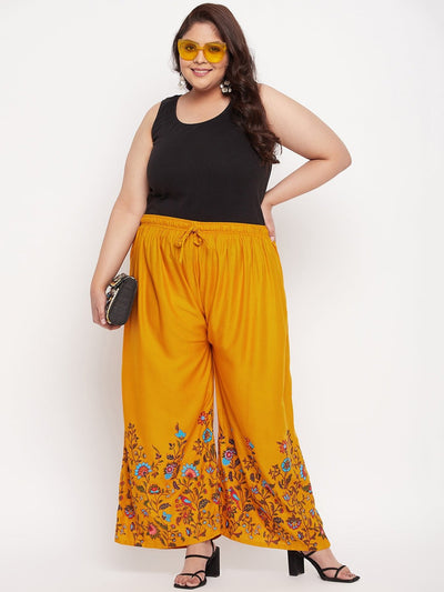 Mustard printed rayon palazzo with elastic waistband and drawstring.