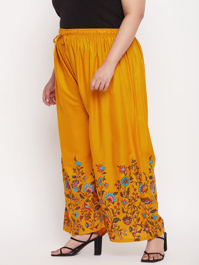 Mustard printed rayon palazzo with floral design and elasticated waistband.