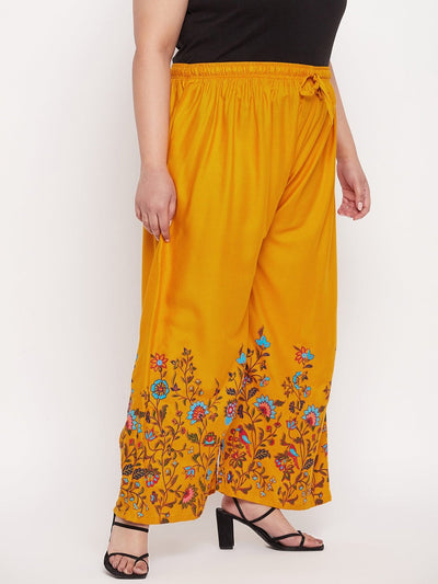 Mustard printed rayon palazzo with elasticated waistband and floral design.