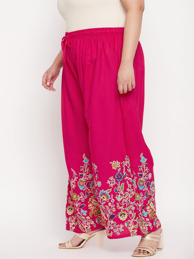 Magenta printed rayon palazzo with elasticated waistband and colorful floral design.