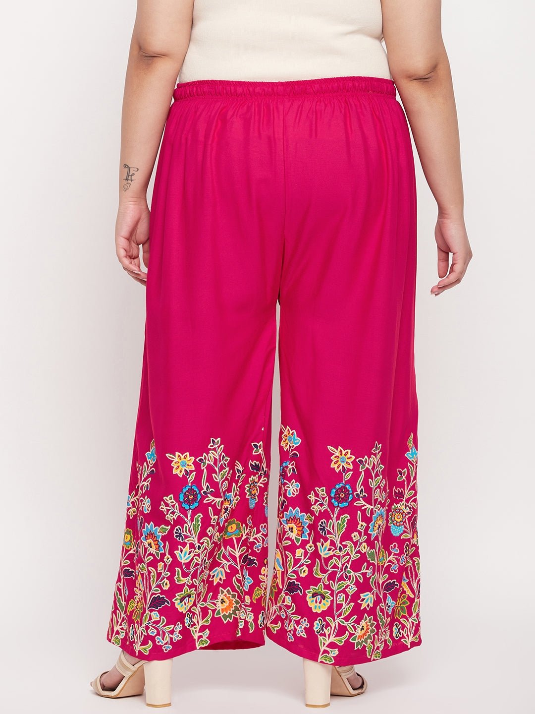 Magenta printed rayon palazzo with elasticated waistband and floral design.