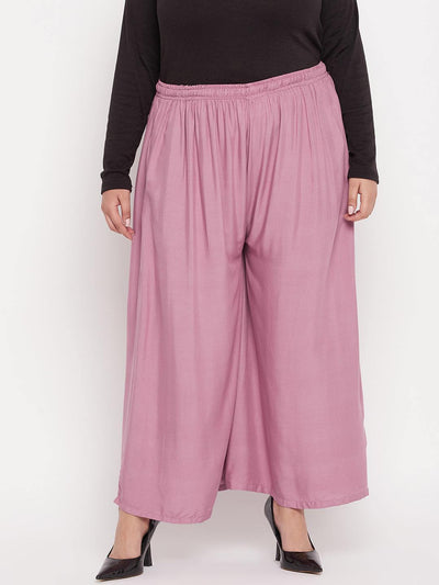 Pink solid rayon jumbo sharara with elasticated waistband and drawstring.