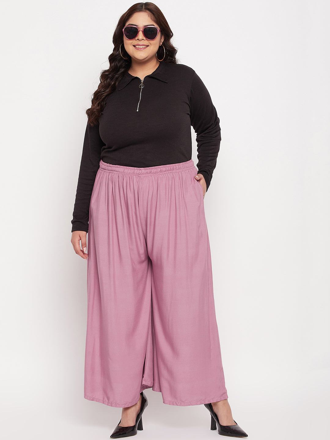 Pink solid rayon jumbo sharara with elasticated waistband.
