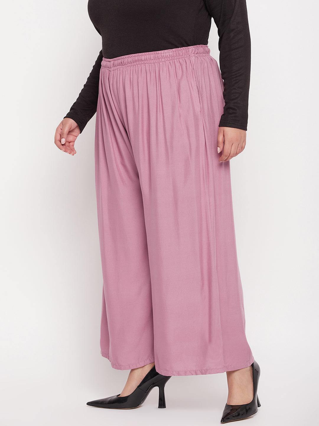 Pink solid rayon jumbo sharara with elasticated waistband and drawstring.
