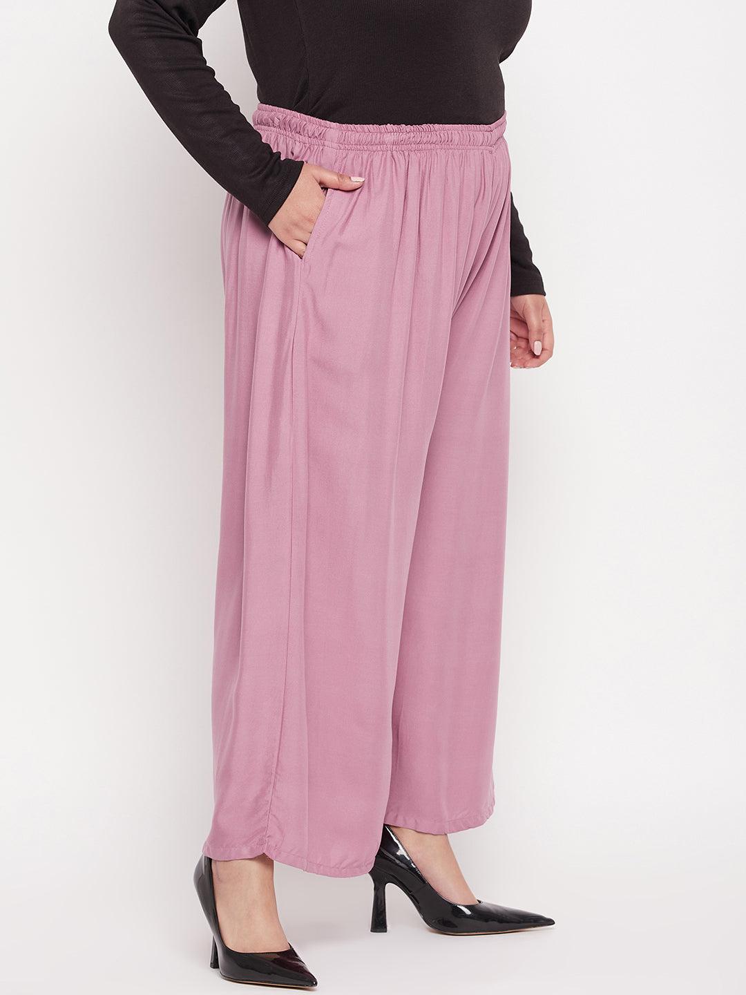 Pink solid rayon jumbo sharara with elasticated waistband and drawstring.