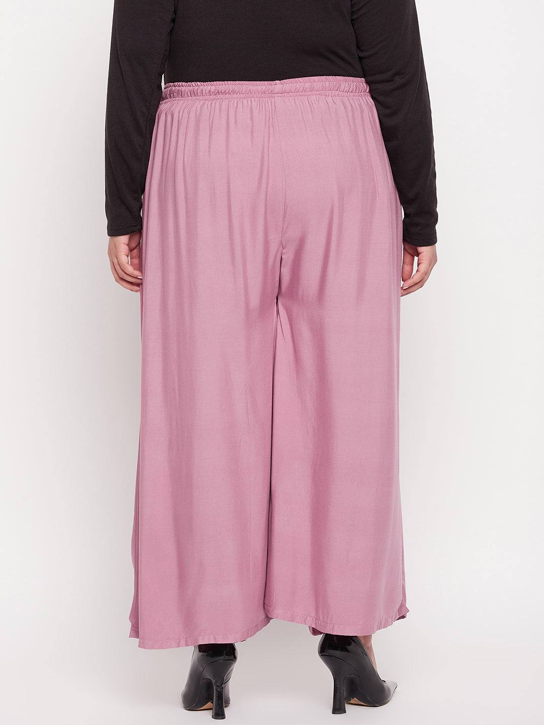 Pink solid rayon jumbo sharara with elasticated waistband and drawstring.