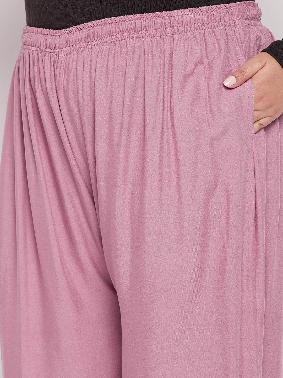 Pink solid rayon jumbo sharara with elasticated waistband.