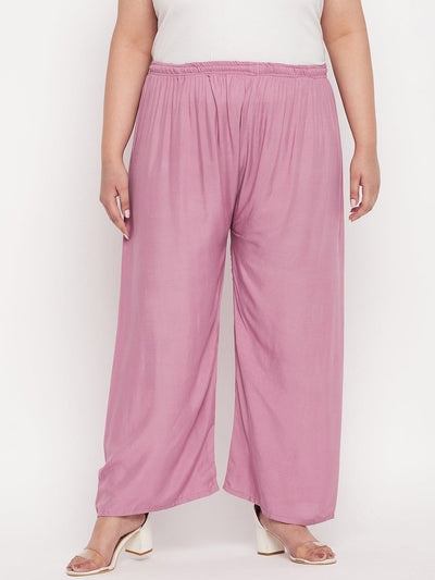 Pink solid rayon palazzo with elasticated waistband and drawstring.