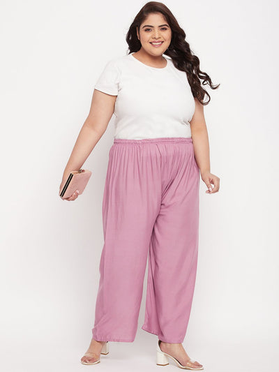 Pink solid rayon palazzo with elasticated waistband and drawstring.