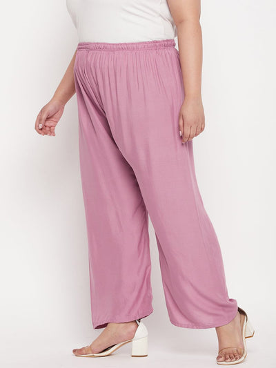Pink solid rayon palazzo with elasticated waistband and drawstring.