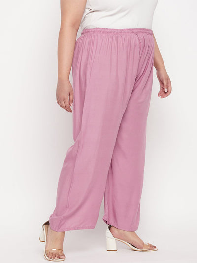Pink solid rayon palazzo with elasticated waistband and drawstring.