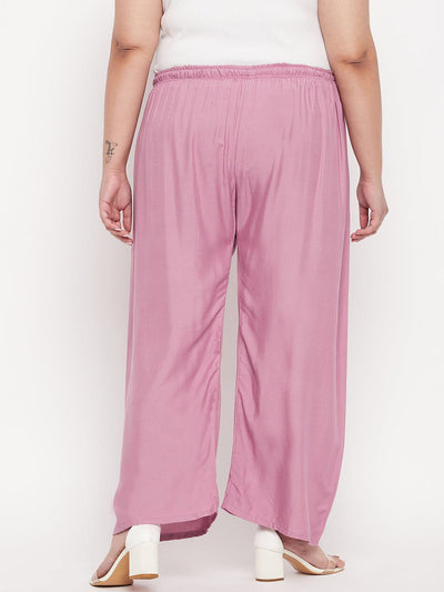 Pink solid rayon palazzo with elasticated waistband and drawstring.