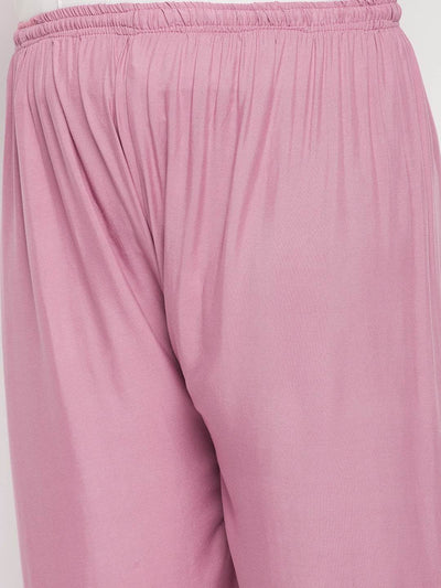 Pink solid rayon palazzo with elasticated waistband and drawstring.