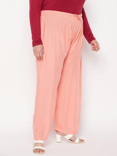 Dark Peach Solid Rayon Palazzo with elasticated waistband and drawstring.