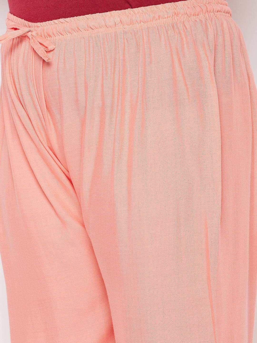 Dark Peach Solid Rayon Palazzo with elasticated waistband and drawstring.