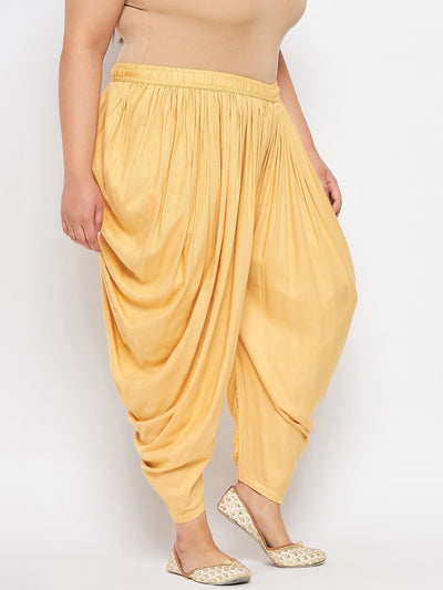 Fawn solid rayon dhoti salwar with elasticated waistband and drawstring.