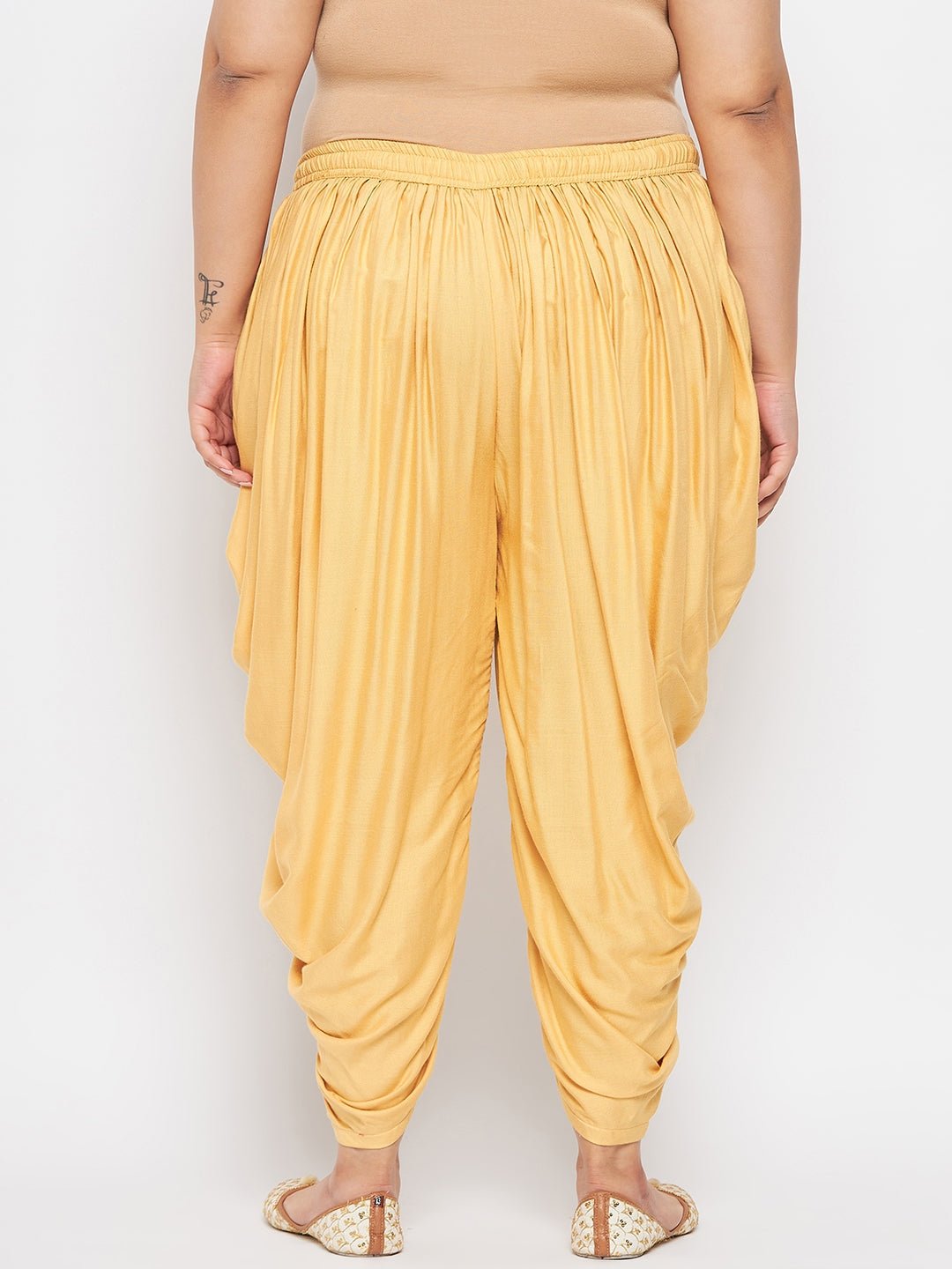 Fawn solid rayon dhoti salwar with elasticated waistband and drawstring.